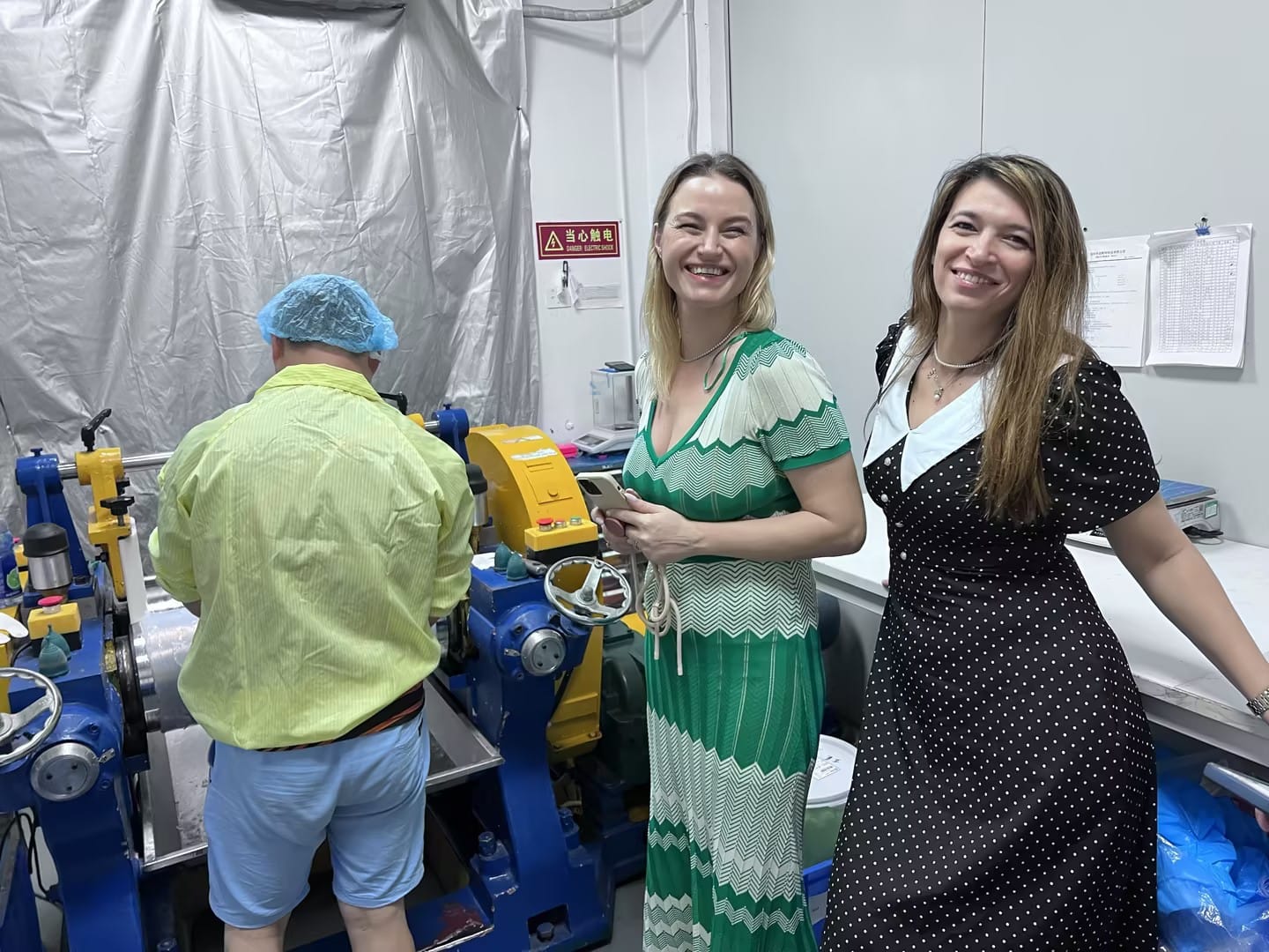 Romanian clients touring the Furuize production workshop during their April 2024 factory visit